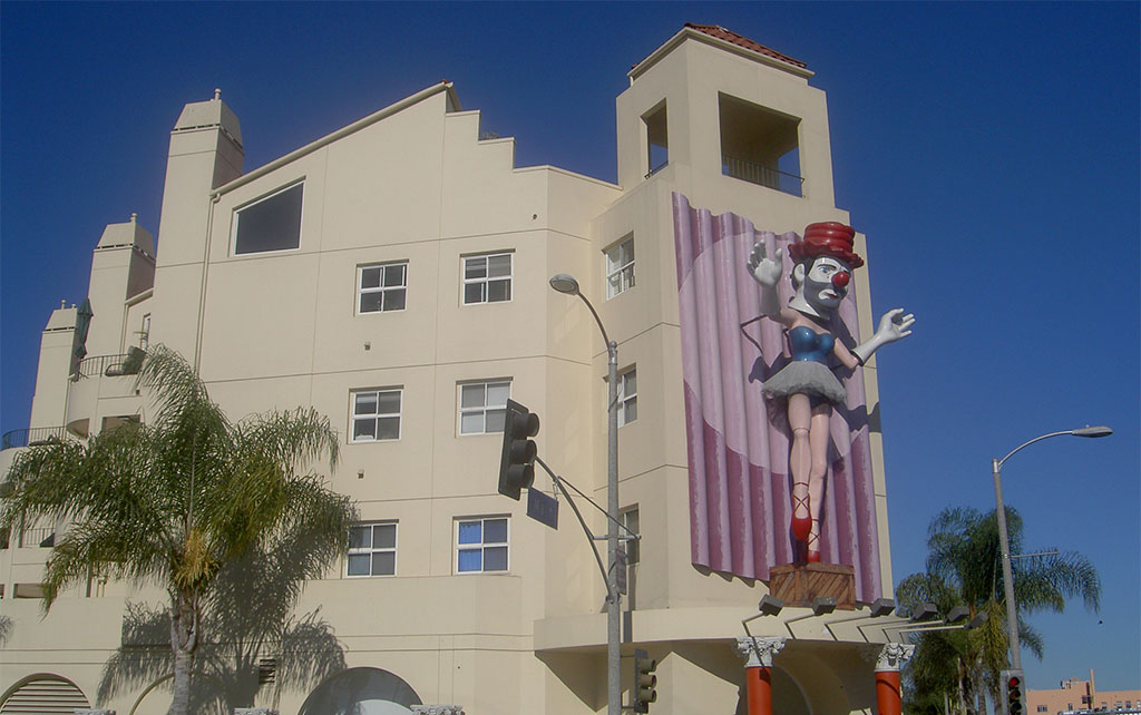 LA building with a large fibre glass clown on the facade