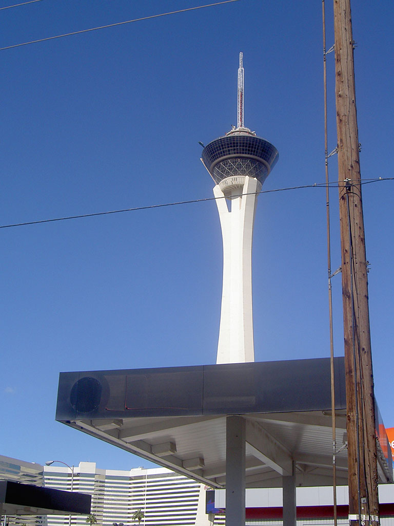 Las Vegas Stratosphere tower behind a petrol station canopy