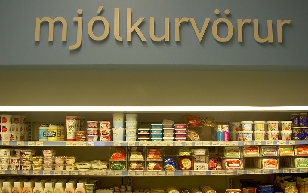 Dairy products in an Icelandic supermarket with a sign that reads 'mjolkurvorur'